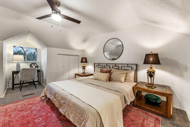 5608 Cougar Dr Unit 220, Austin, TX 78745 - bedroom with vaulted ceiling, carpet flooring, a textured ceiling, a closet, and ceiling fan