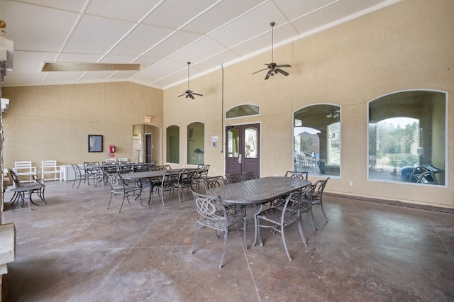 dining area with ceiling fan and a patio area