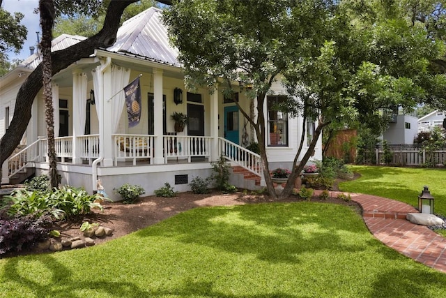 209 E Elizabeth St, Austin, TX 78704 - view of front facade featuring a porch and metal roof