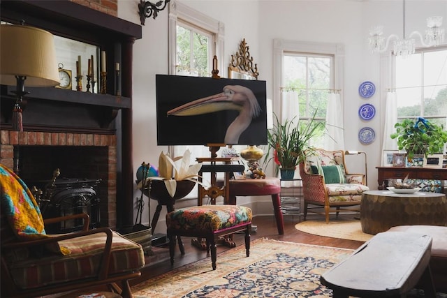 209 E Elizabeth St, Austin, TX 78704 - sitting room with wood finished floors and a chandelier