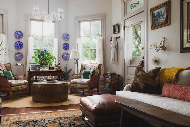 209 E Elizabeth St, Austin, TX 78704 - living area featuring a chandelier and wood finished floors
