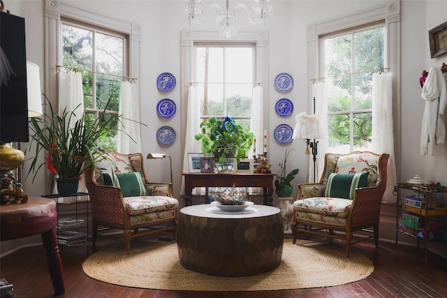 209 E Elizabeth St, Austin, TX 78704 - living area with hardwood / wood-style flooring and a chandelier