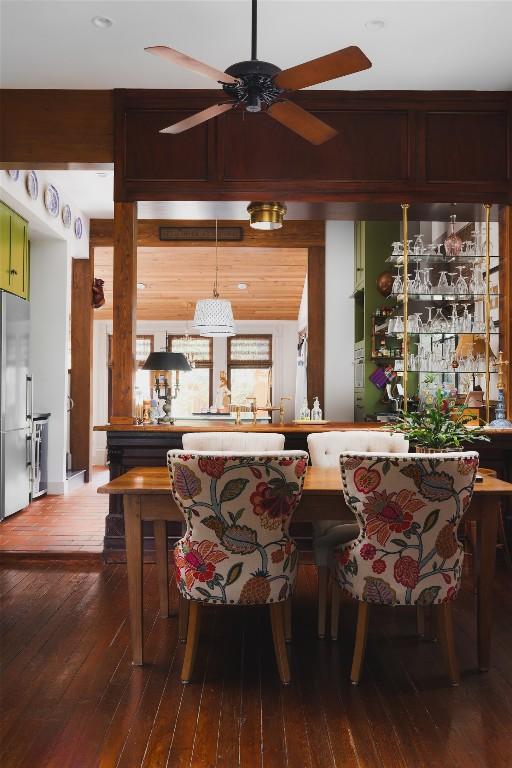 209 E Elizabeth St, Austin, TX 78704 - bar area with stainless steel fridge, ceiling fan, and dark wood-type flooring