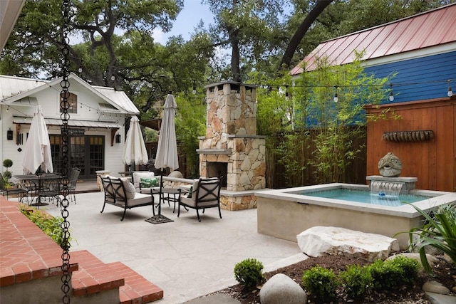 209 E Elizabeth St, Austin, TX 78704 - view of patio featuring an outdoor structure and an outdoor living space with a fireplace