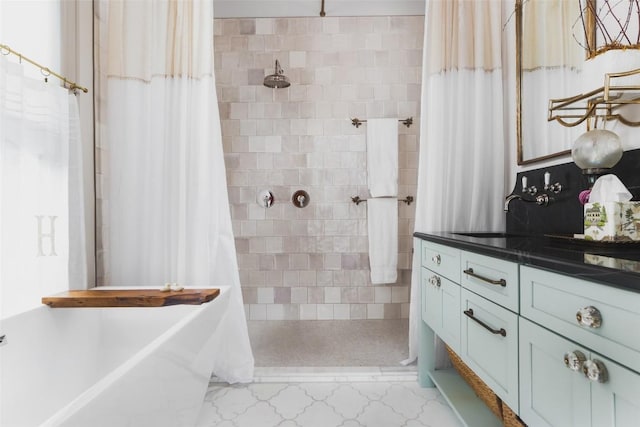 209 E Elizabeth St, Austin, TX 78704 - full bathroom with tiled shower, a soaking tub, and vanity