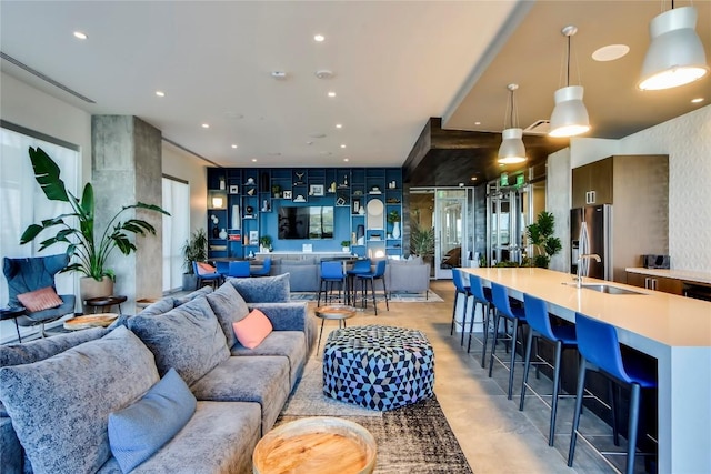 222 W Ave Unit 1312, Austin, TX 78701 - living room featuring finished concrete floors and recessed lighting