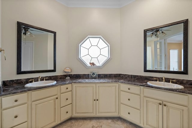 bathroom featuring vanity, crown molding, and ceiling fan