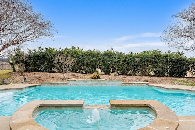 view of pool with an in ground hot tub