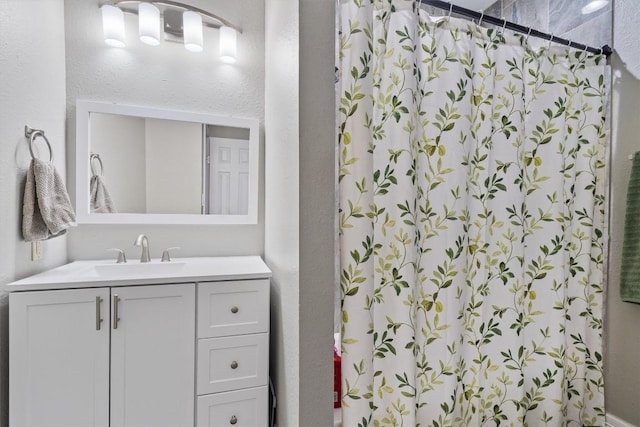 bathroom featuring vanity and walk in shower