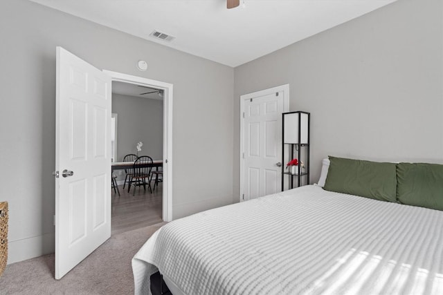 carpeted bedroom featuring ceiling fan