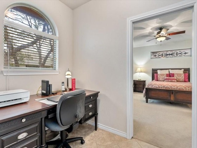 office space with ceiling fan and light tile patterned floors