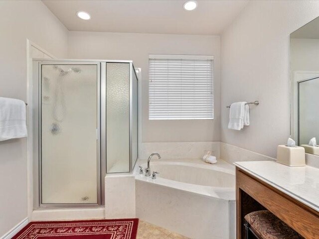 909 Big Thicket St, Georgetown, TX 78633 - full bathroom featuring vanity, a stall shower, a garden tub, and recessed lighting