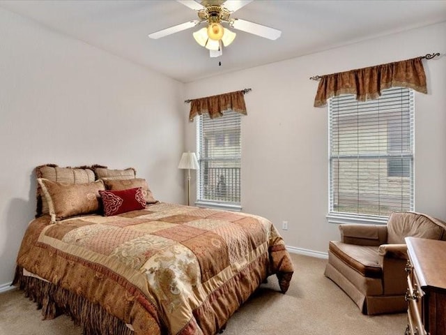 bedroom featuring light carpet and ceiling fan