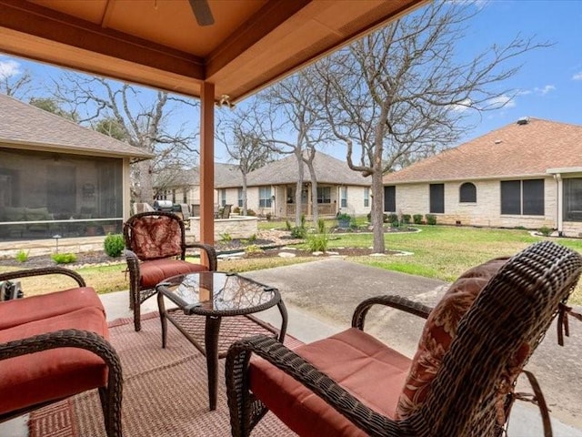 view of patio / terrace with ceiling fan, an outdoor hangout area, and a sunroom