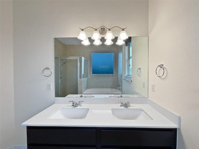 bathroom featuring vanity and separate shower and tub