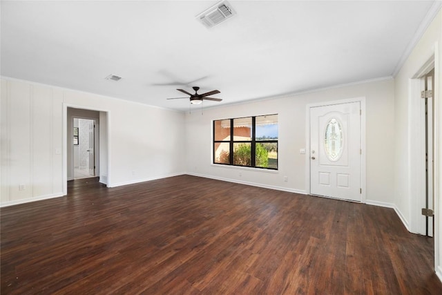 foyer with crown molding, dark wood-type flooring, and ceiling fan