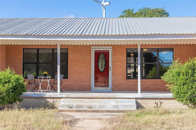 doorway to property featuring covered porch