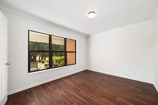 spare room featuring dark hardwood / wood-style flooring and ornamental molding