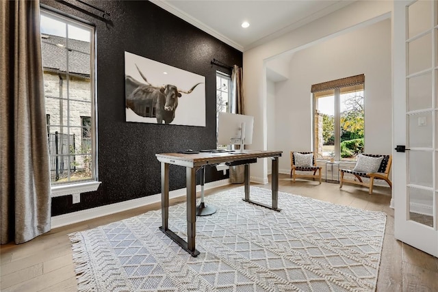 home office with crown molding and hardwood / wood-style floors