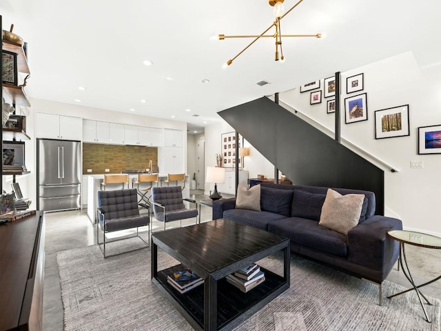 living room with an inviting chandelier