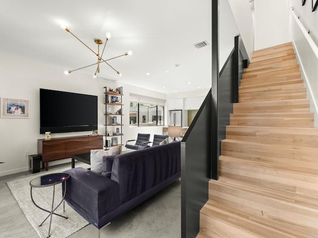 living room featuring light hardwood / wood-style flooring and a chandelier