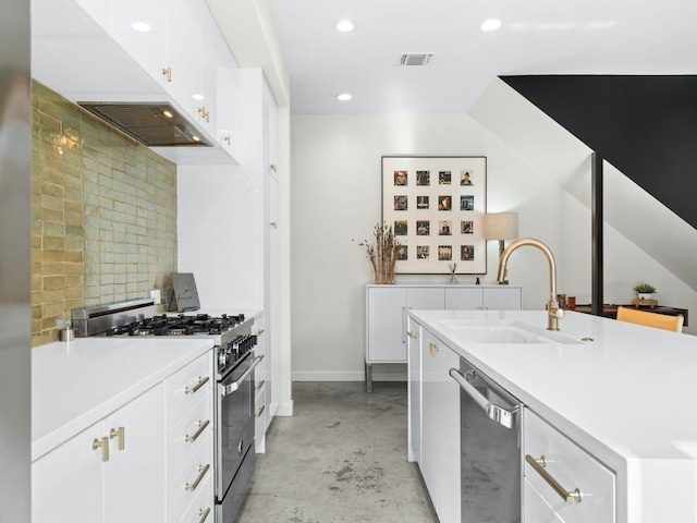 kitchen with appliances with stainless steel finishes, sink, and white cabinets