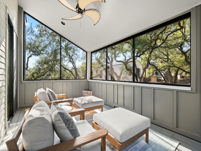 sunroom featuring a healthy amount of sunlight and ceiling fan