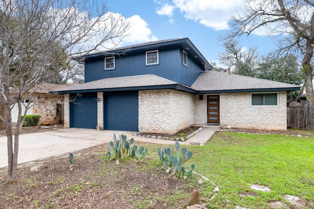 view of front property with a garage and a front yard