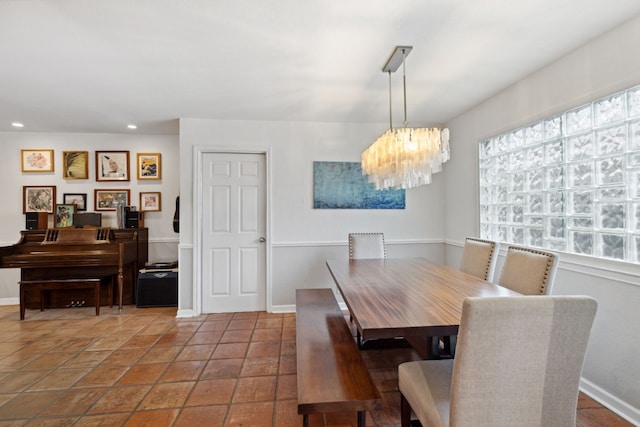 dining space featuring a chandelier