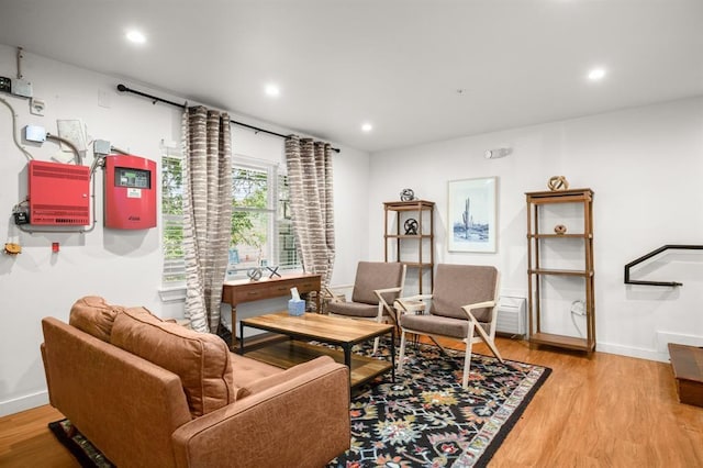 sitting room with light hardwood / wood-style flooring