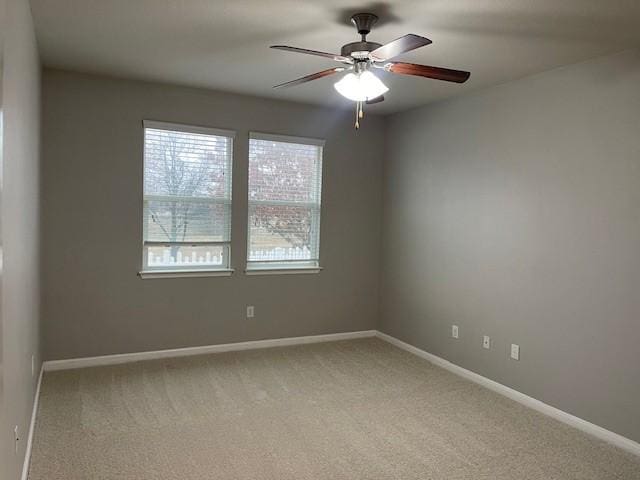 unfurnished room with carpet floors and ceiling fan