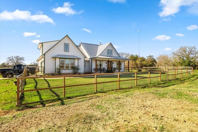 1430 Antioch Rd, Paige, TX 78659 - rear view of property featuring a porch and a metal roof