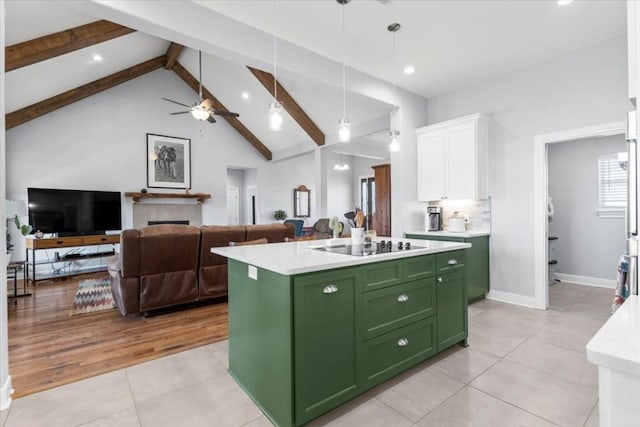 1430 Antioch Rd, Paige, TX 78659 - kitchen with green cabinetry, white cabinetry, light tile patterned flooring, beam ceiling, and light countertops