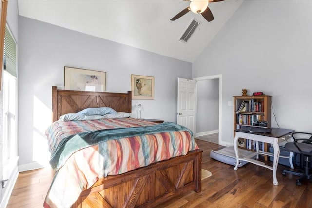 1430 Antioch Rd, Paige, TX 78659 - bedroom with high vaulted ceiling, wood finished floors, and ceiling fan