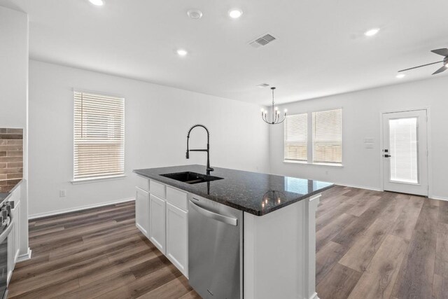 4829 Mozzafiato Ln, Round Rock, TX 78665 - kitchen with dishwasher, white cabinetry, dark wood-type flooring, a chandelier, and recessed lighting