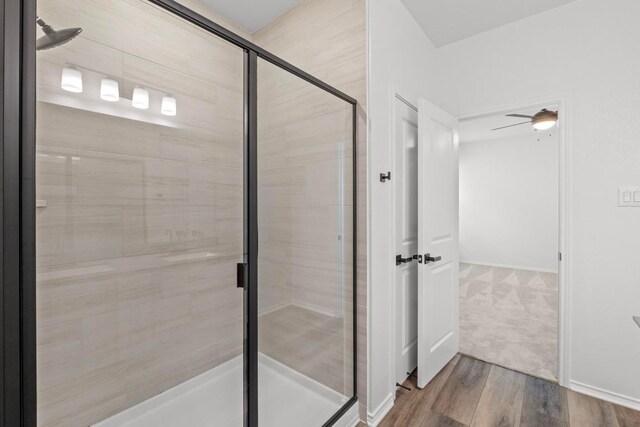 4829 Mozzafiato Ln, Round Rock, TX 78665 - bathroom featuring a shower stall and wood finished floors