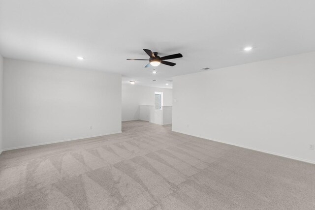 4829 Mozzafiato Ln, Round Rock, TX 78665 - spare room with a ceiling fan, recessed lighting, and light colored carpet