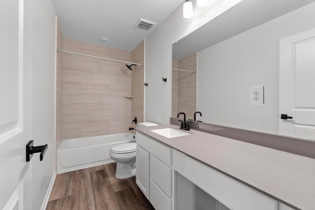 4829 Mozzafiato Ln, Round Rock, TX 78665 - bathroom with vanity, shower / bathtub combination, and wood finished floors