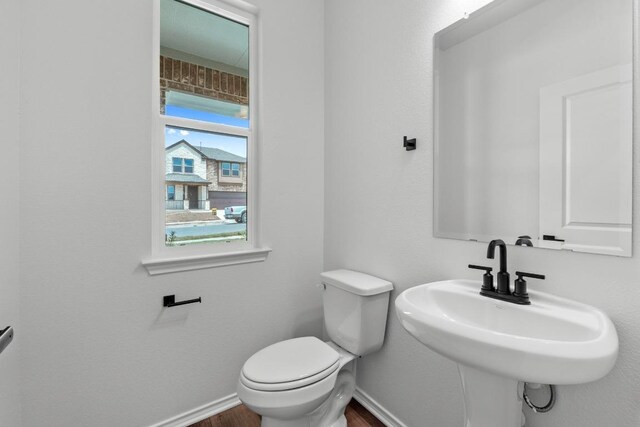 4829 Mozzafiato Ln, Round Rock, TX 78665 - half bathroom with baseboards and wood finished floors