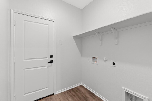 4829 Mozzafiato Ln, Round Rock, TX 78665 - washroom with hookup for a washing machine, hookup for an electric dryer, dark wood-style floors, and hookup for a gas dryer