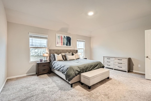 bedroom featuring light carpet