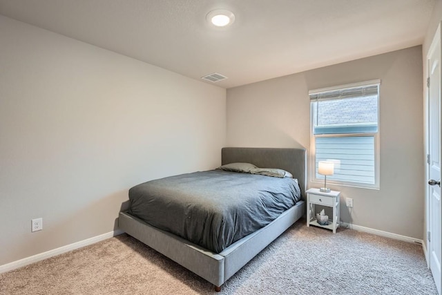 bedroom with light carpet