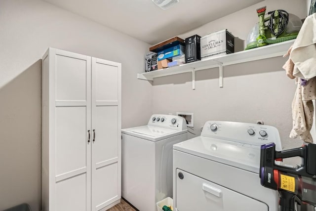 laundry area with separate washer and dryer