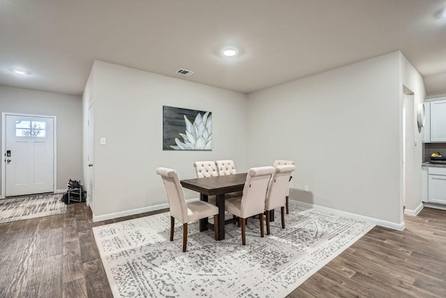 dining room with dark hardwood / wood-style floors