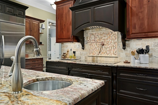 kitchen featuring ornamental molding, custom range hood, black electric stovetop, light stone countertops, and decorative backsplash