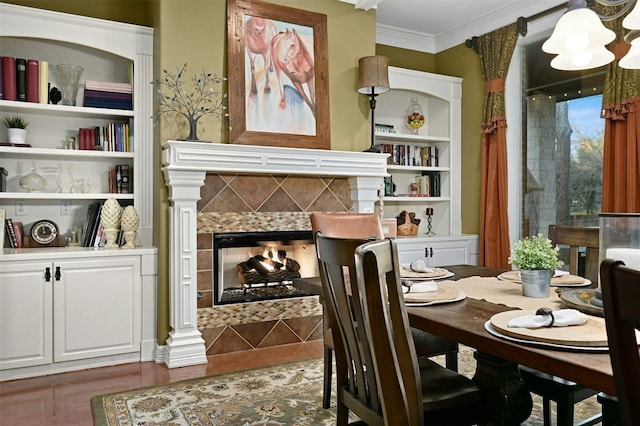 tiled dining room featuring crown molding and a fireplace