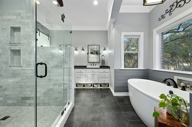 bathroom featuring vanity, tile patterned flooring, ornamental molding, and independent shower and bath