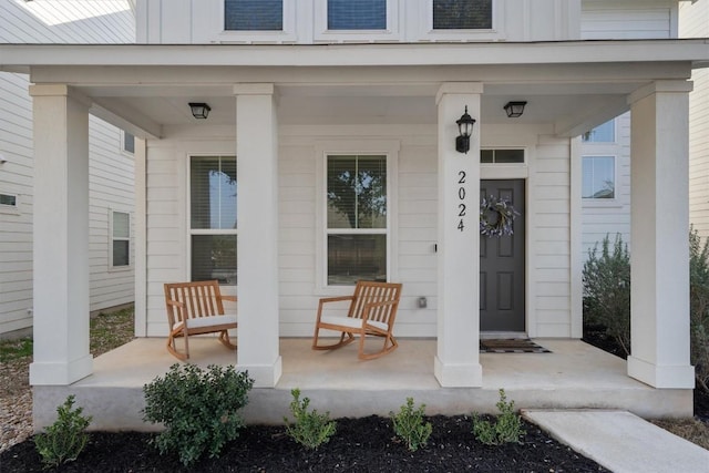 property entrance with covered porch