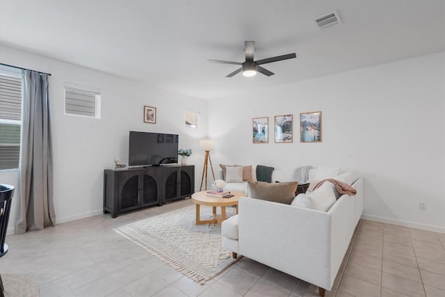 living room featuring ceiling fan and light tile patterned floors