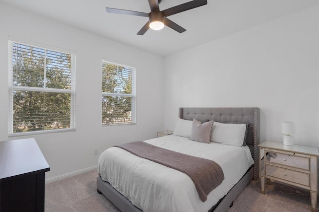 bedroom featuring ceiling fan and carpet